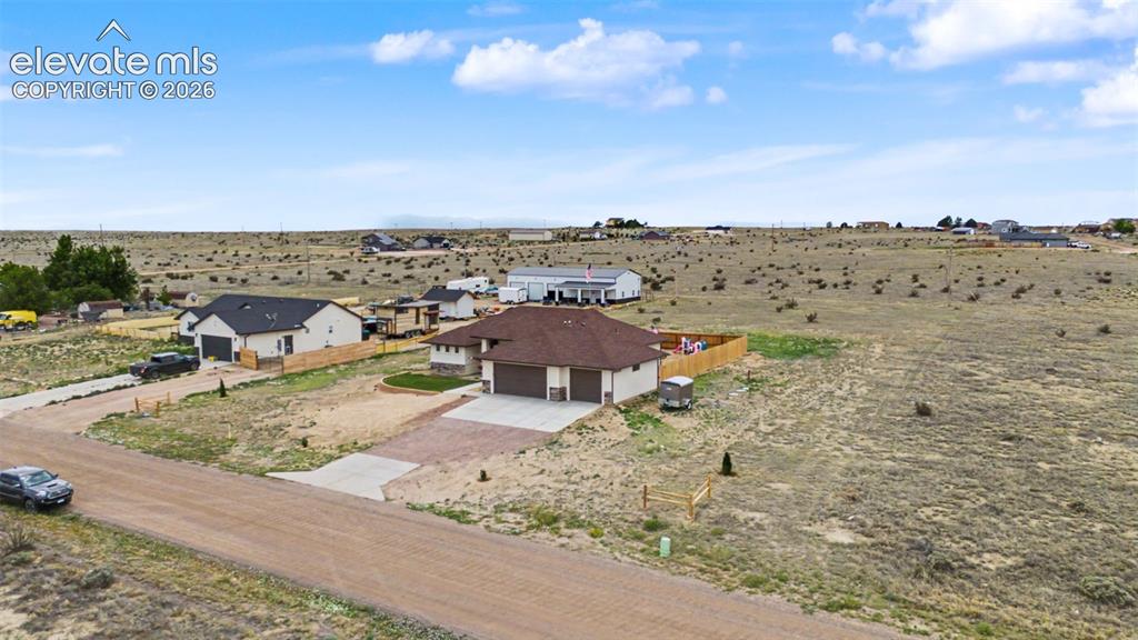 Image 8 of 47: Contemporary ranch-style home featuring a two-car garage, concrete driveway