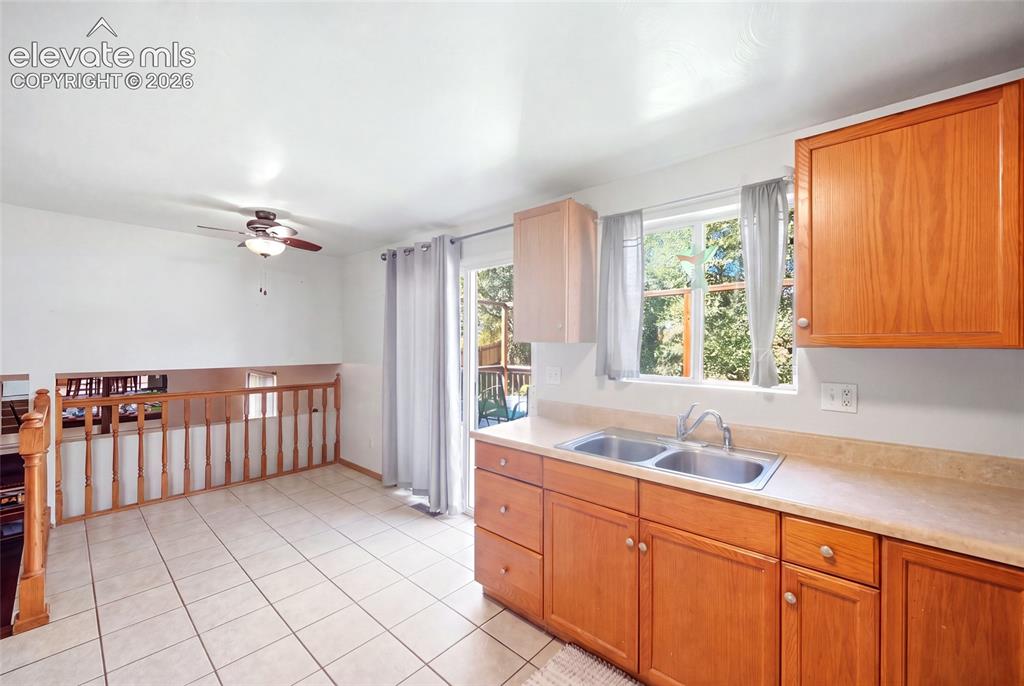 Image 15 of 39: Main level.  AI removed items from kitchen and dining room
