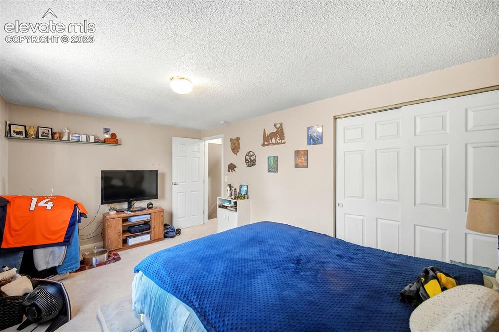 Image 20 of 39: Upper level primary bedroom