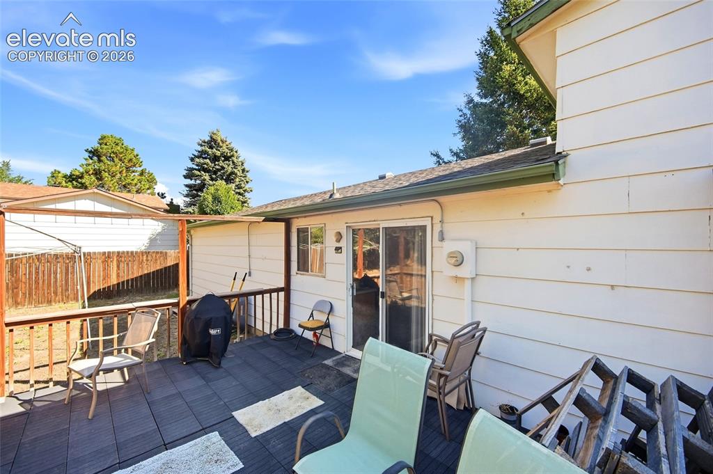 Image 33 of 39: Rear yard with view of rear deck