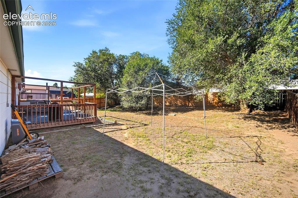 Image 35 of 39: Rear yard with view of rear deck