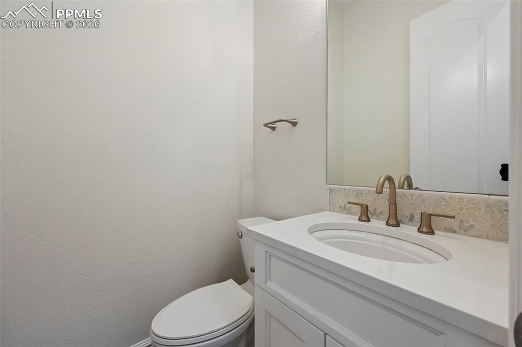 Image 15 of 50: Main level powder room