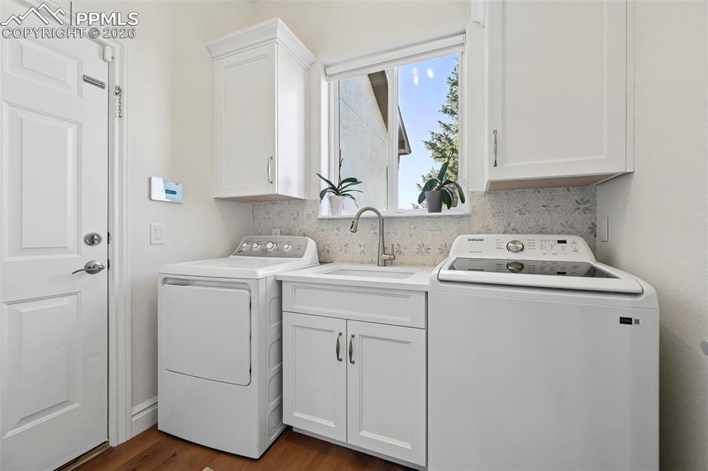 Image 16 of 50: Mud room and laundry room off of garage