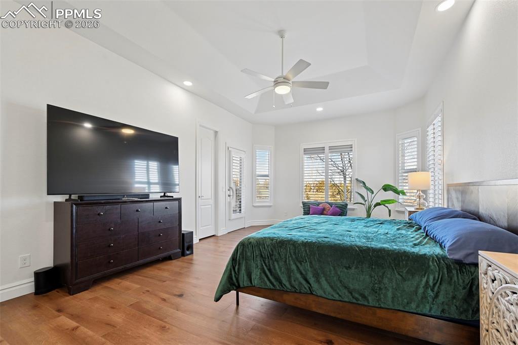 Image 24 of 50: Primary bedroom with walk-out access to deck