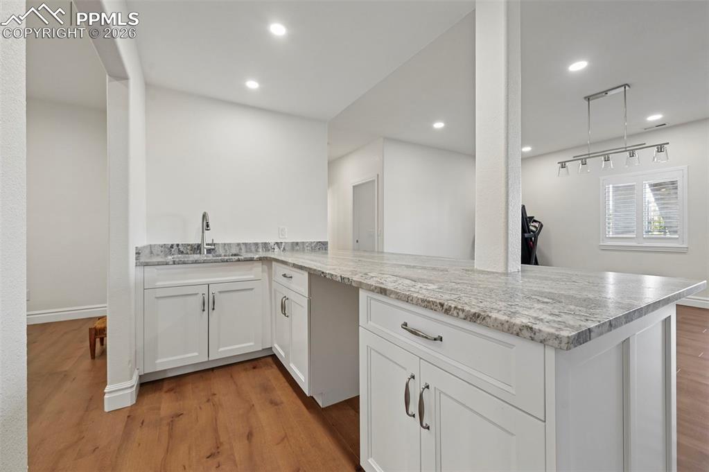Image 28 of 50: Large secondary wet bar with room for kitchette creation
