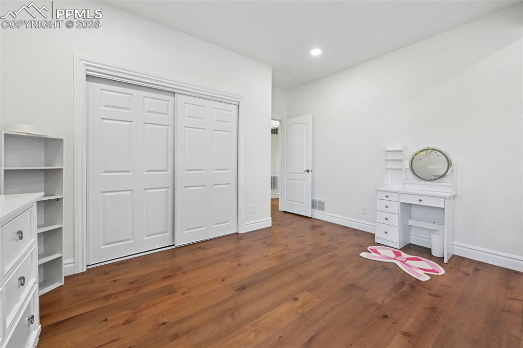 Image 38 of 50: Basement bedroom