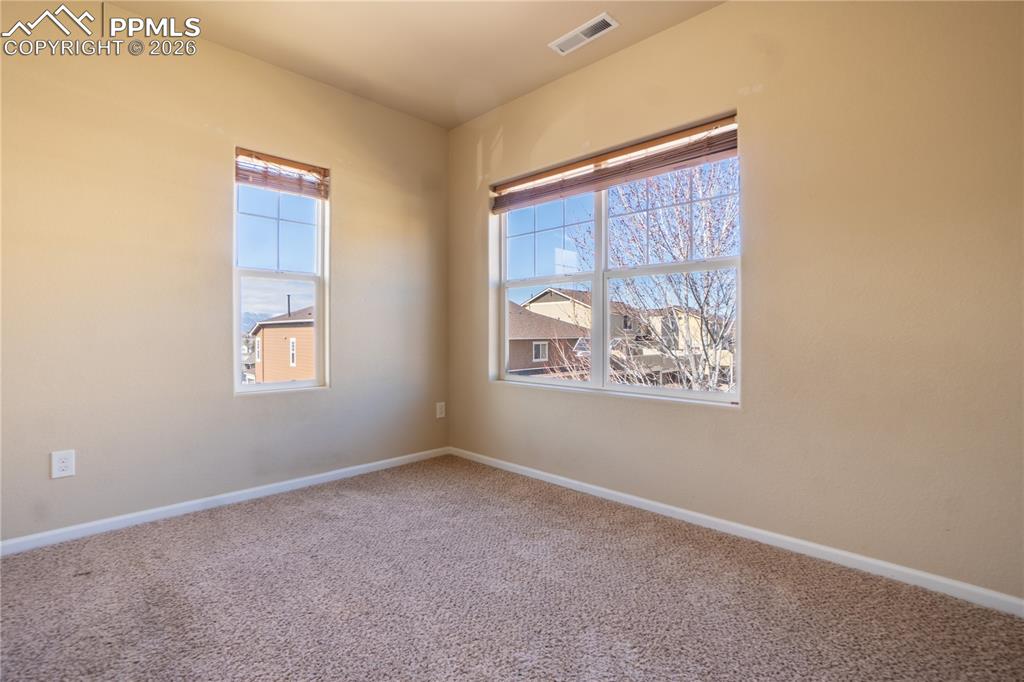 Image 19 of 33: Unfurnished room featuring carpet floors and baseboards