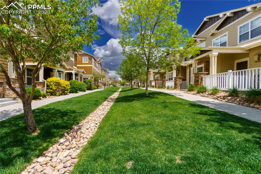 Image 29 of 33: Surrounding community featuring a residential view and covered porch