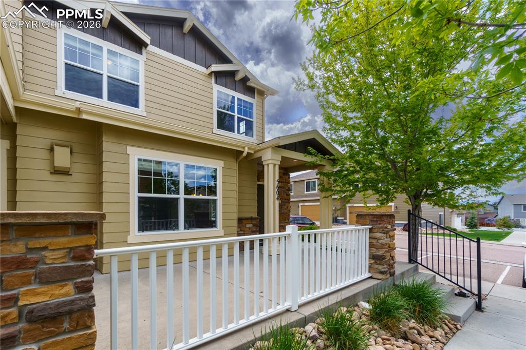 Image 3 of 33: Craftsman inspired home featuring board and batten siding