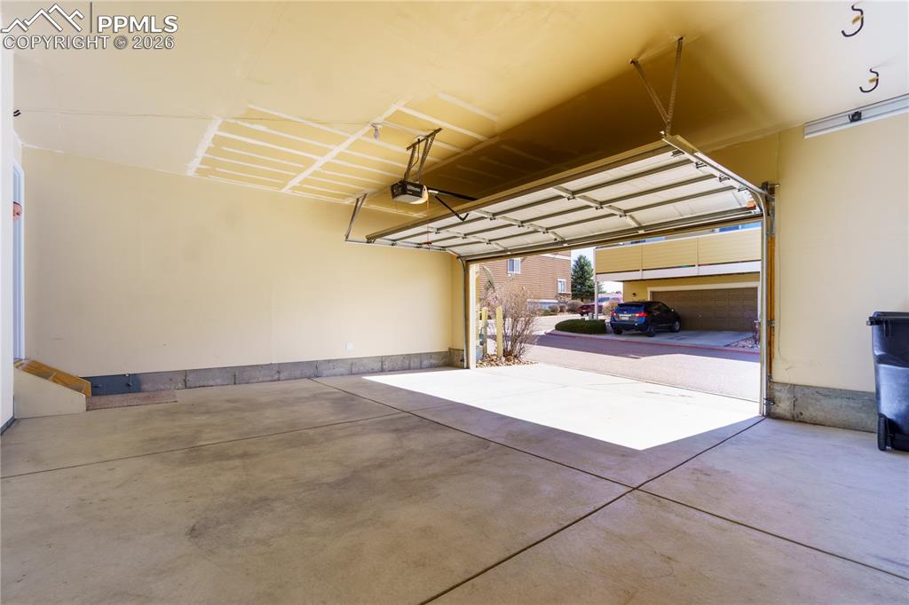 Image 31 of 33: Garage with a garage door opener