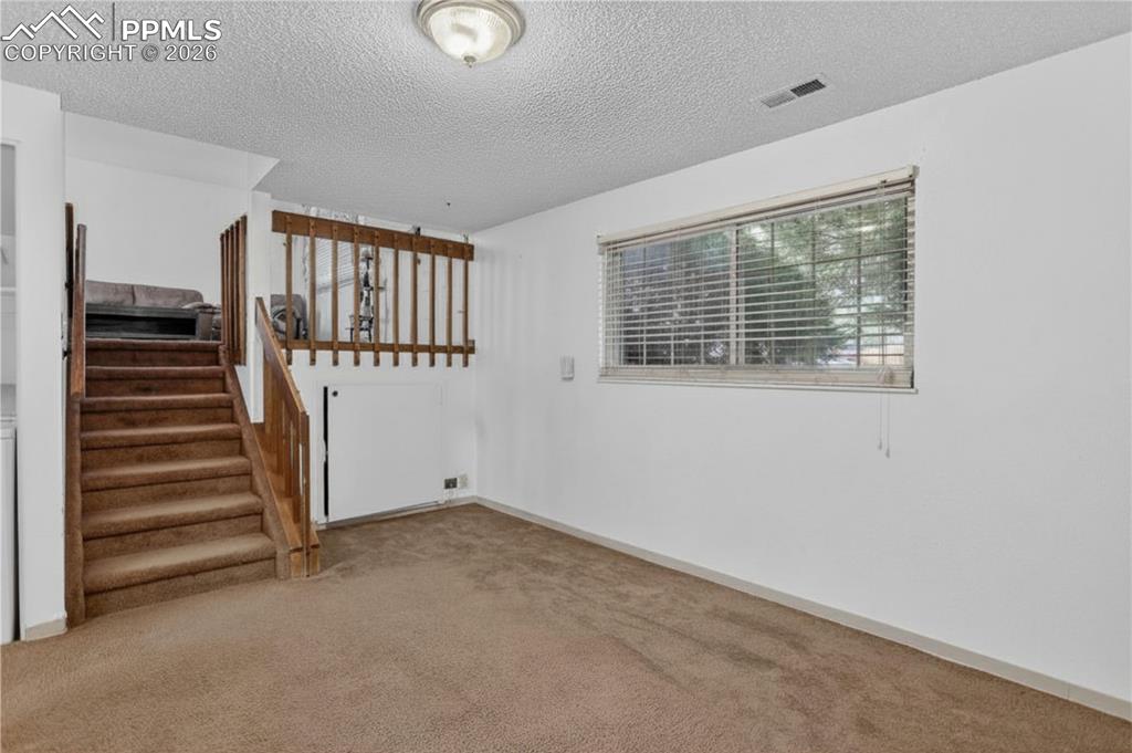 Image 10 of 17: Additional entertainment space on lower level