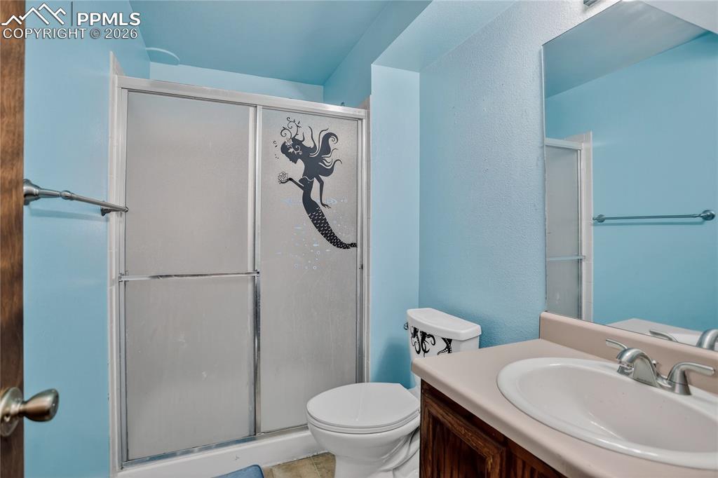 Image 13 of 17: Guest bath - lower level