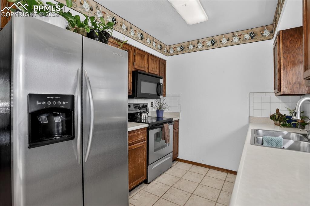 Image 6 of 17: Galley style kitchen