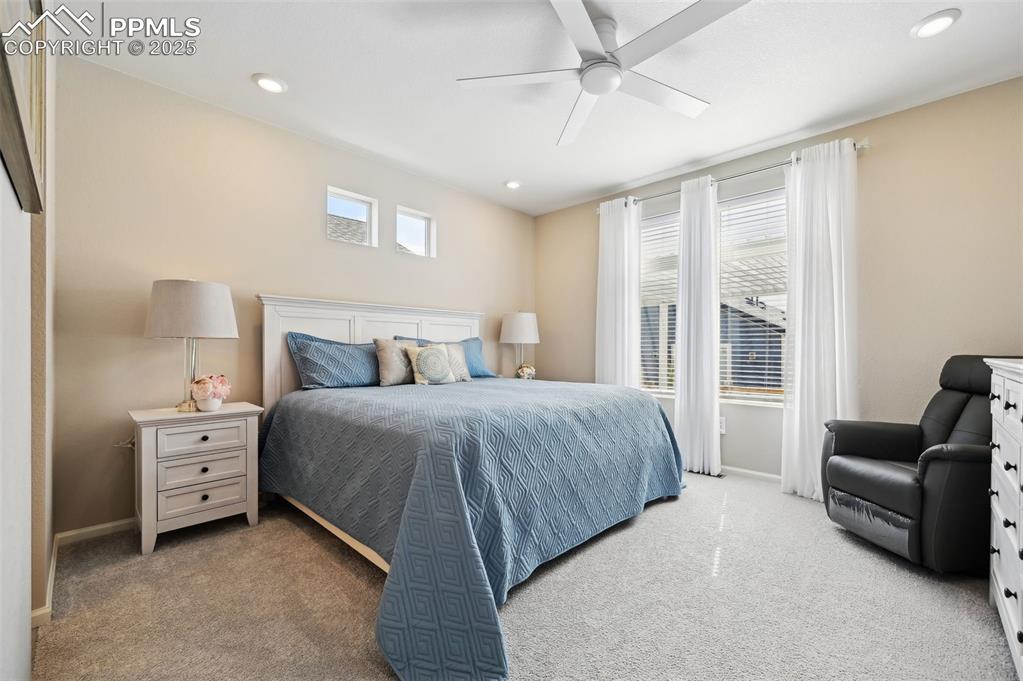 Image 15 of 44: Carpeted bedroom featuring baseboards, recessed lighting, and ceiling fan