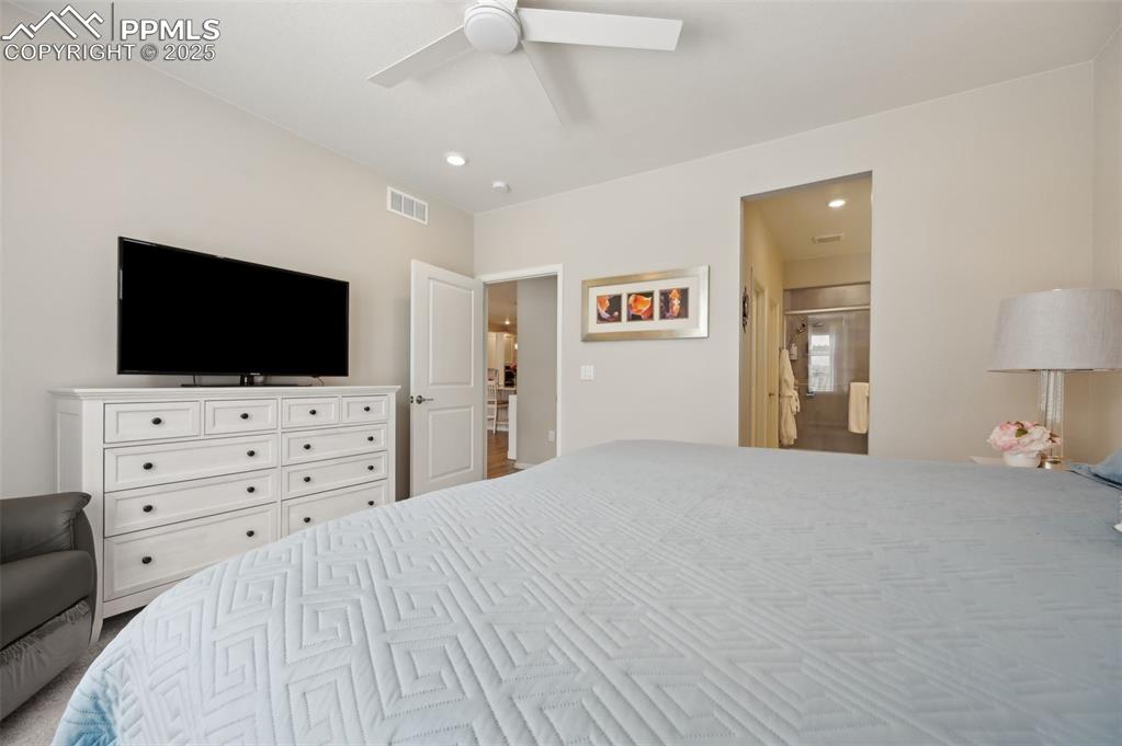 Image 18 of 44: Bedroom featuring ceiling fan and recessed lighting
