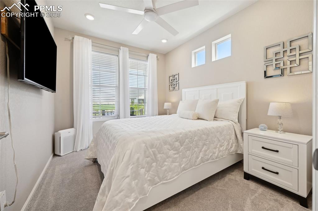 Image 22 of 44: Bedroom with light carpet, recessed lighting, baseboards, and ceiling fan