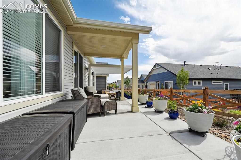 Image 35 of 44: View of patio / terrace with fence and a residential view