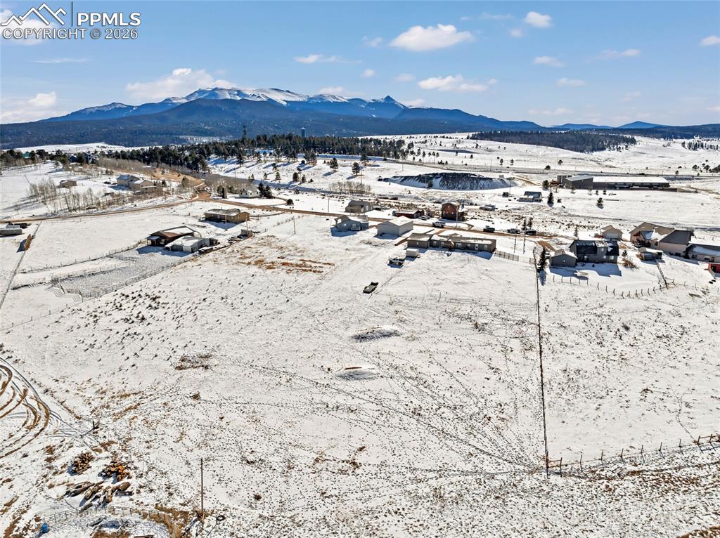 Image 36 of 36: Snowy aerial view with a mountain view