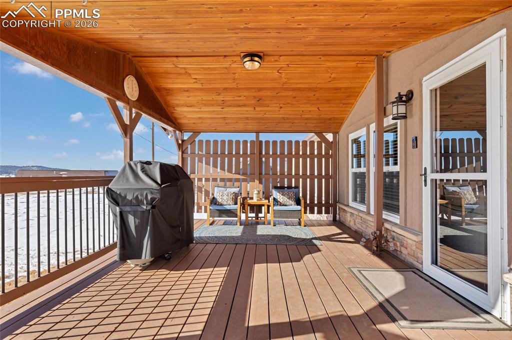 Image 9 of 36: Deck featuring a grill