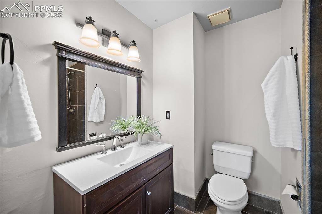 Image 20 of 38: Primary bathroom featuring vanity and a shower