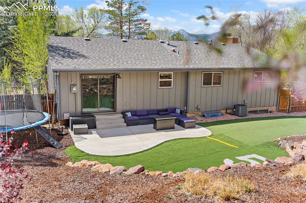 Image 36 of 38: Rear view of house with a patio area, a fenced backyard, outdoor furniture,