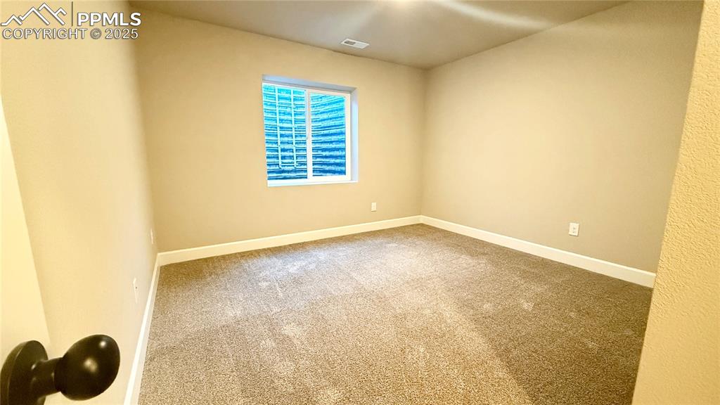 Image 28 of 41: Basement Bedroom
