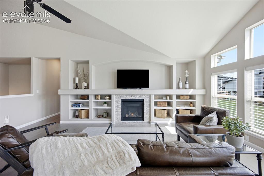 Image 15 of 45: A cozy fireplace and built-in