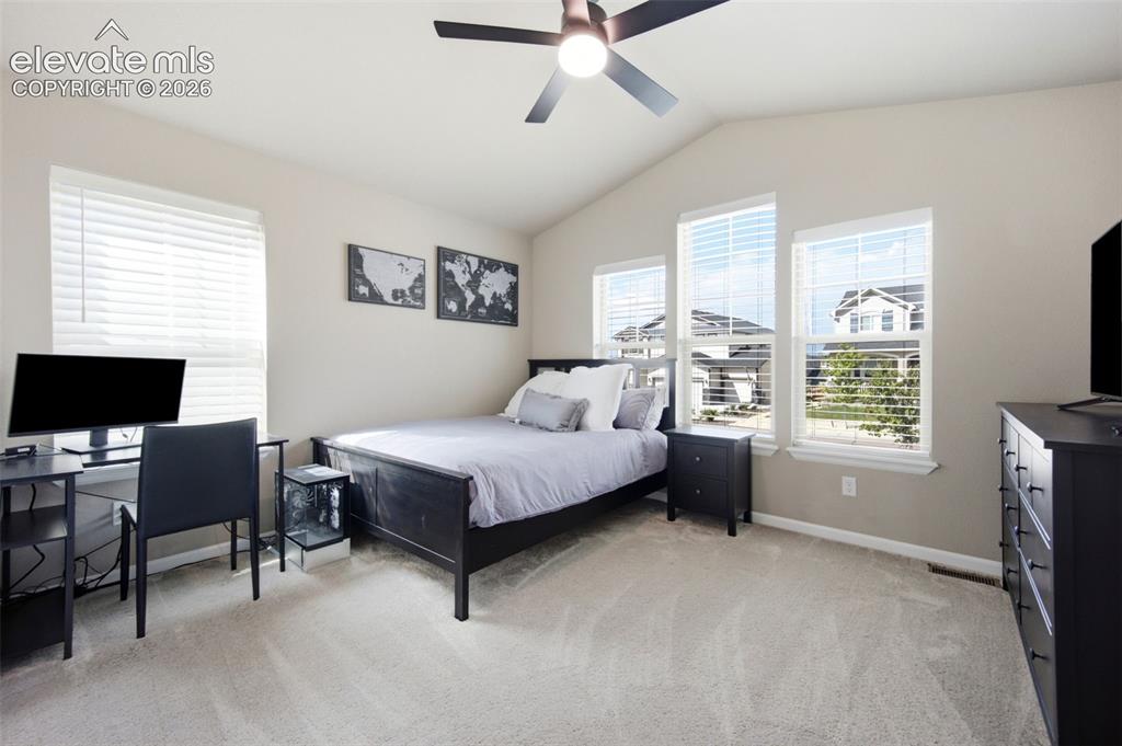 Image 24 of 45: A second Main-level bedroom also features high ceilings