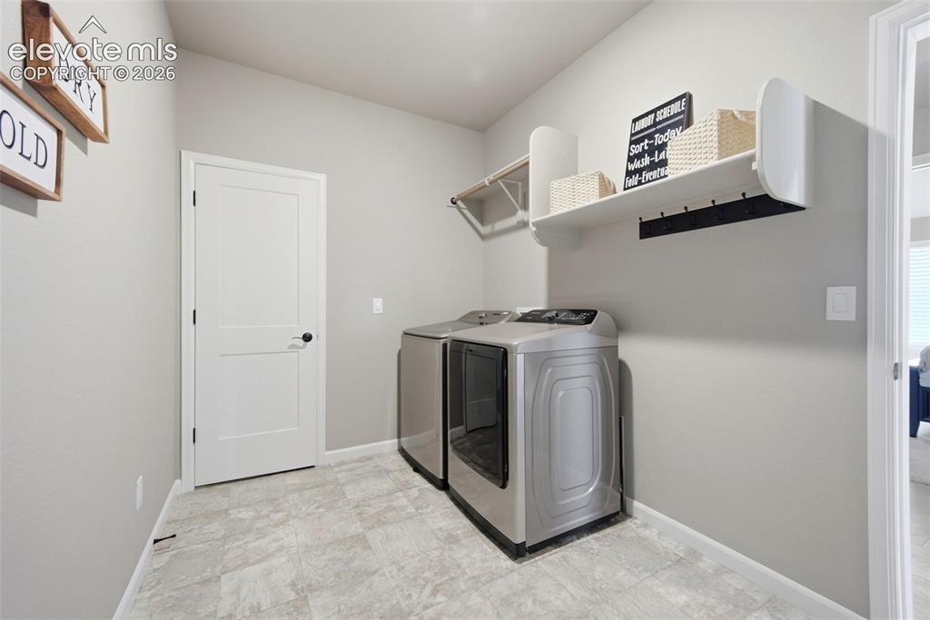 Image 27 of 45: Convenient laundry room on main level