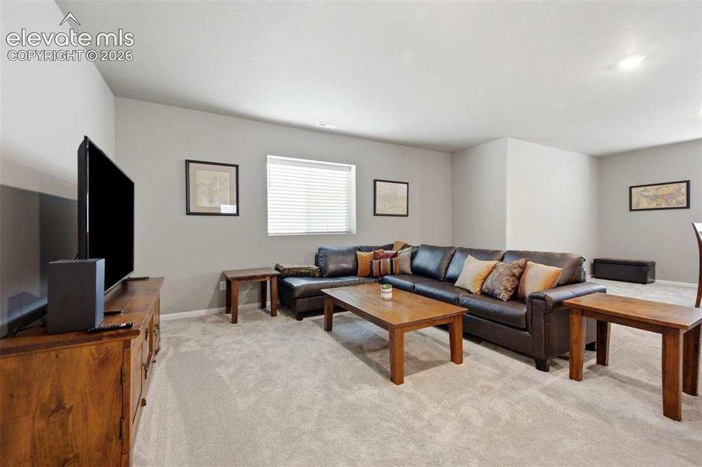 Image 28 of 45: The basement space offers high ceilings and plenty of natural light