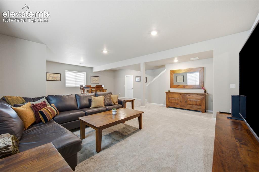 Image 29 of 45: Family room offers plenty of space for entertaining