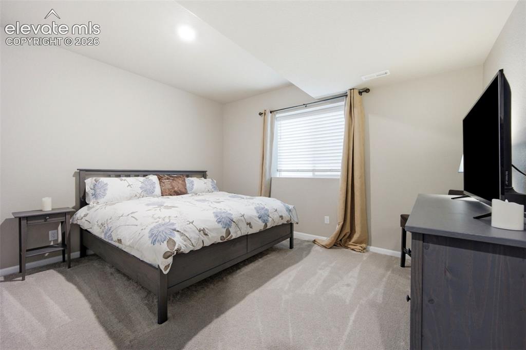 Image 36 of 45: A large third bedroom in basement