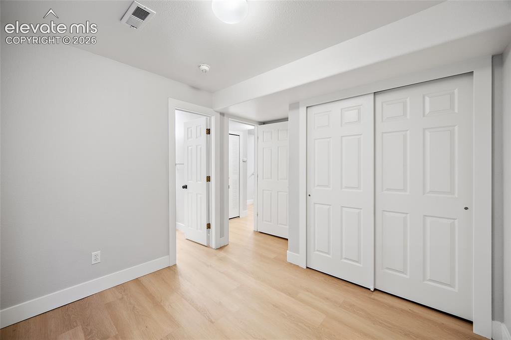 Image 20 of 28: Basement Bedroom