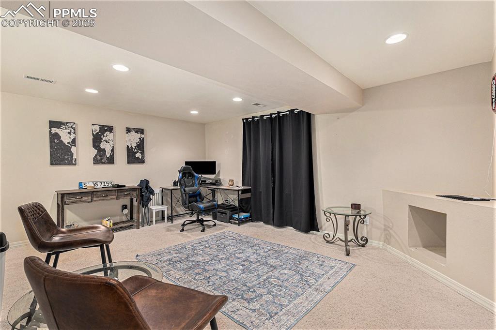 Image 18 of 21: Home office featuring visible vents, baseboards, recessed lighting, and car