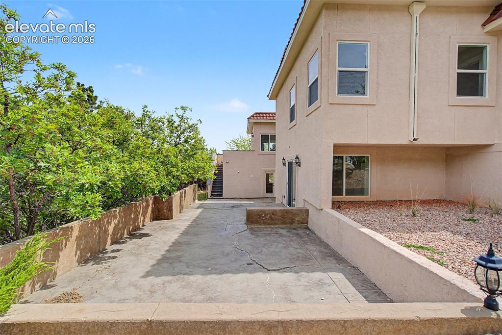 Image 46 of 50: Rear exterior showcasing multiple outdoor living areas with access from bot