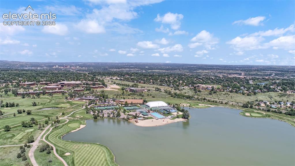 Image 47 of 50: Nearby Country Club of Colorado featuring golf, lake, tennis, and recreatio
