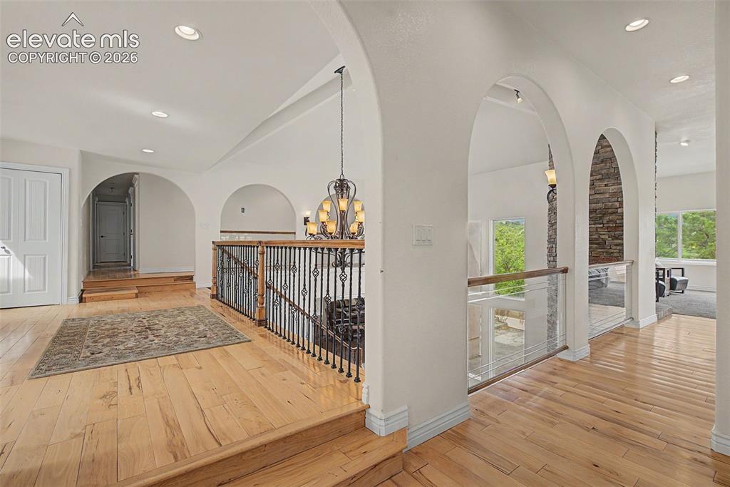 Image 7 of 50: Open mezzanine design with views of the soaring two-story window wall