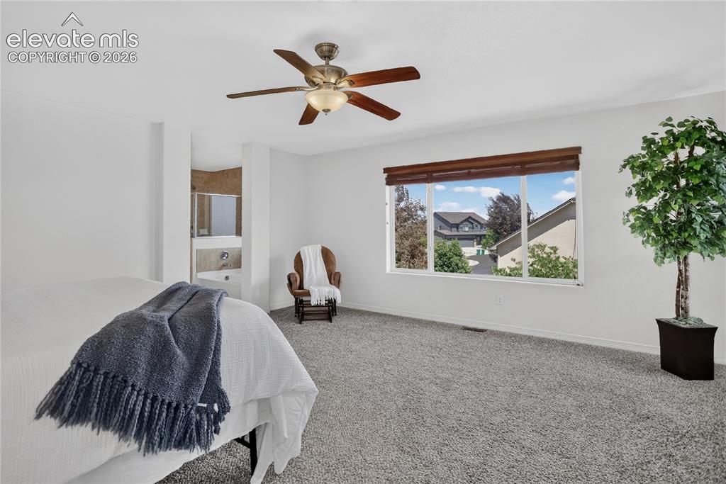 Image 14 of 23: Large bedroom w/ space for sitting area