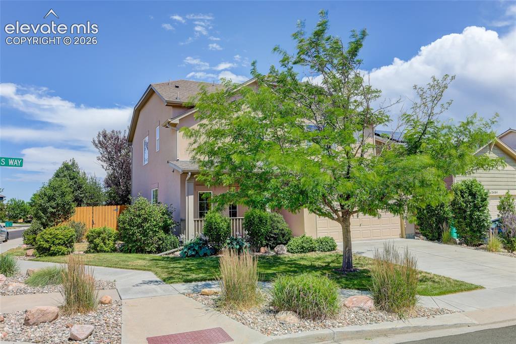 Image 23 of 23: Corner lot with mature landscaping