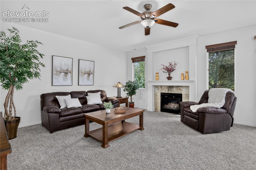 Image 5 of 23: Living room w/ fireplace