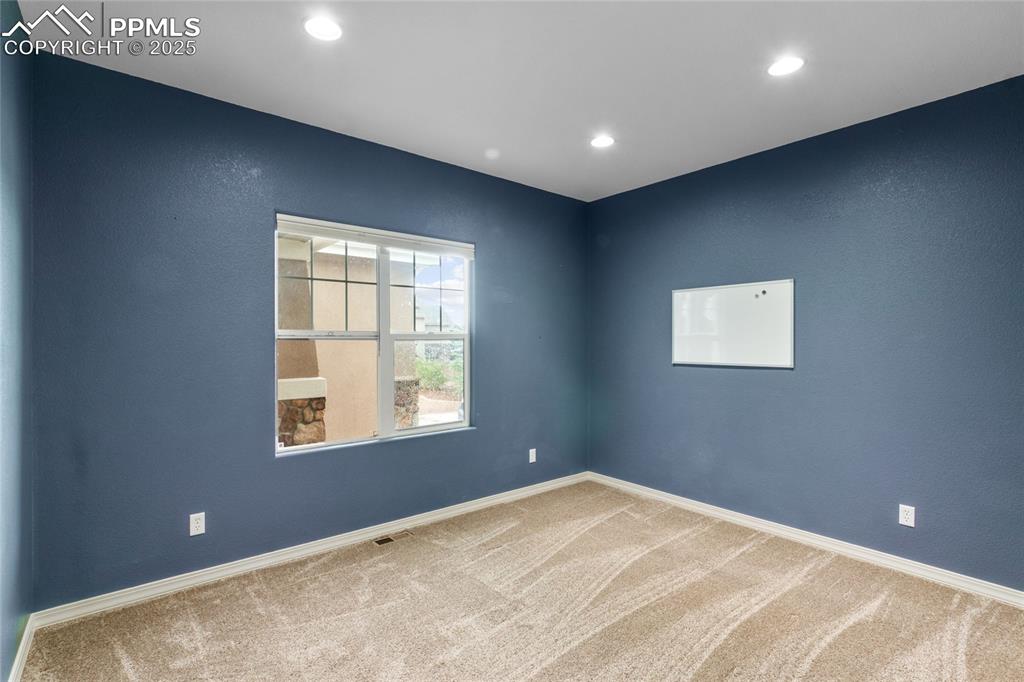 Image 11 of 36: Unfurnished room with carpet floors and recessed lighting