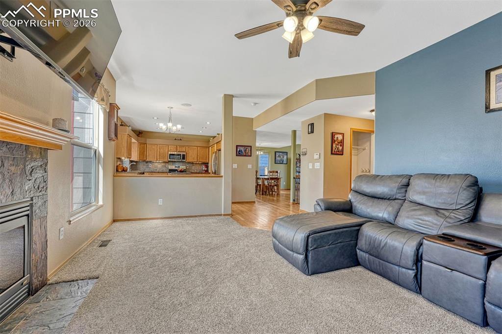 Image 16 of 40: Family room open to kitchen