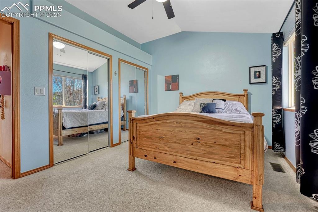 Image 27 of 40: Bedroom featuring sloped ceilings