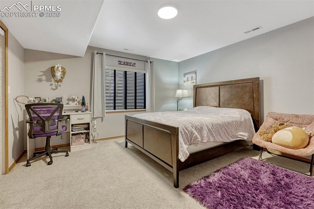 Image 33 of 40: Lower level 5th bedroom