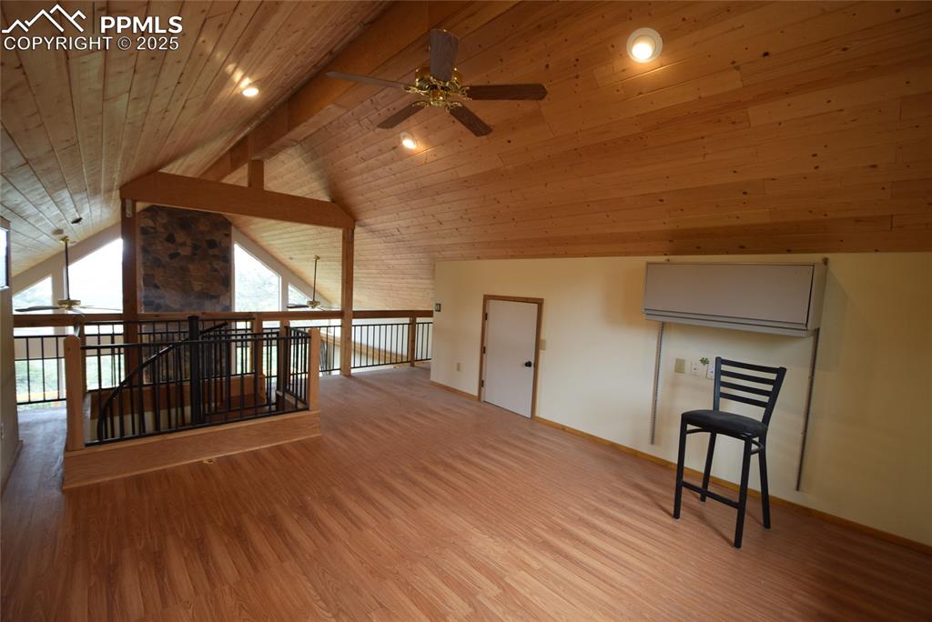 Image 21 of 44: Additional living space featuring a ceiling fan, light wood finished floors
