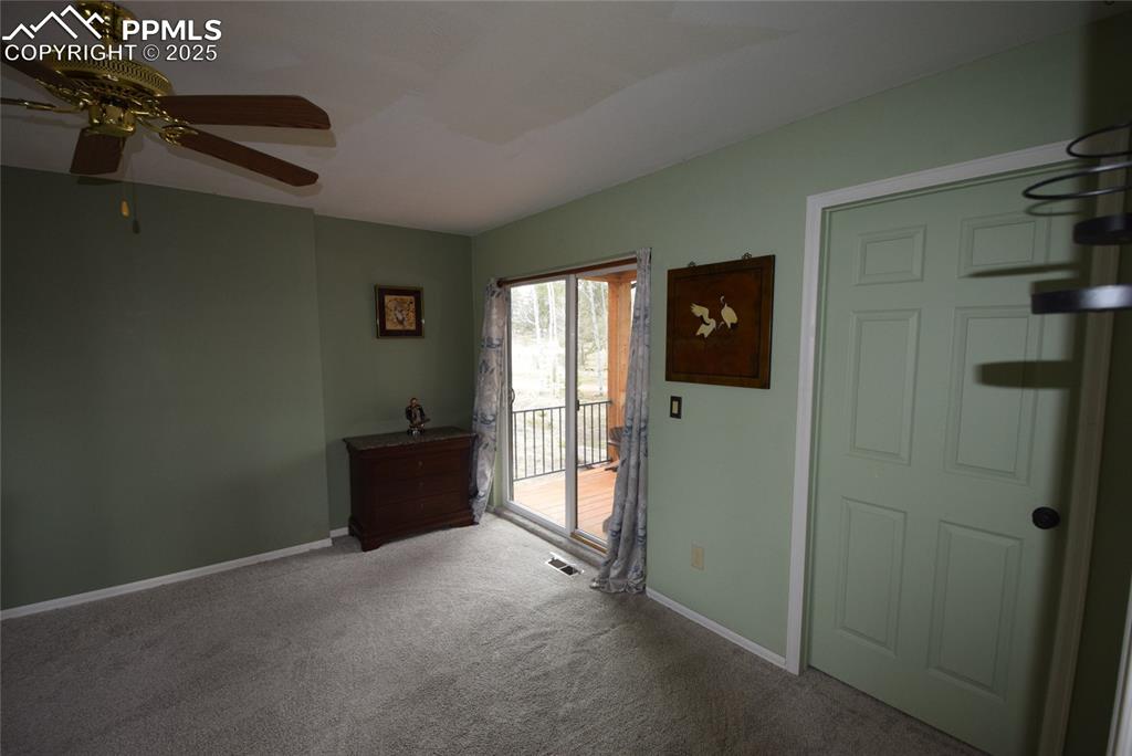 Image 22 of 44: Carpeted entrance foyer with baseboards and a ceiling fan