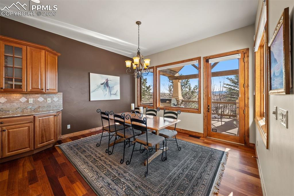 Image 15 of 40: Breakfast nook with mountain views and direct access to the deck for seamle
