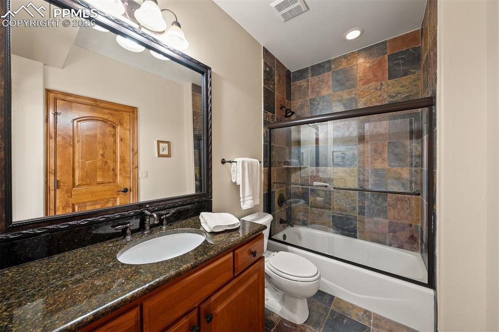 Image 35 of 40: Full bathroom en suite to bedroom 6 with dual access from the bedroom and f