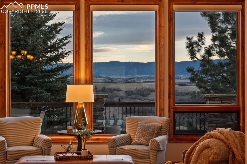 Image 5 of 40: Sweeping Front Range views are beautifully framed by expansive windows, cre