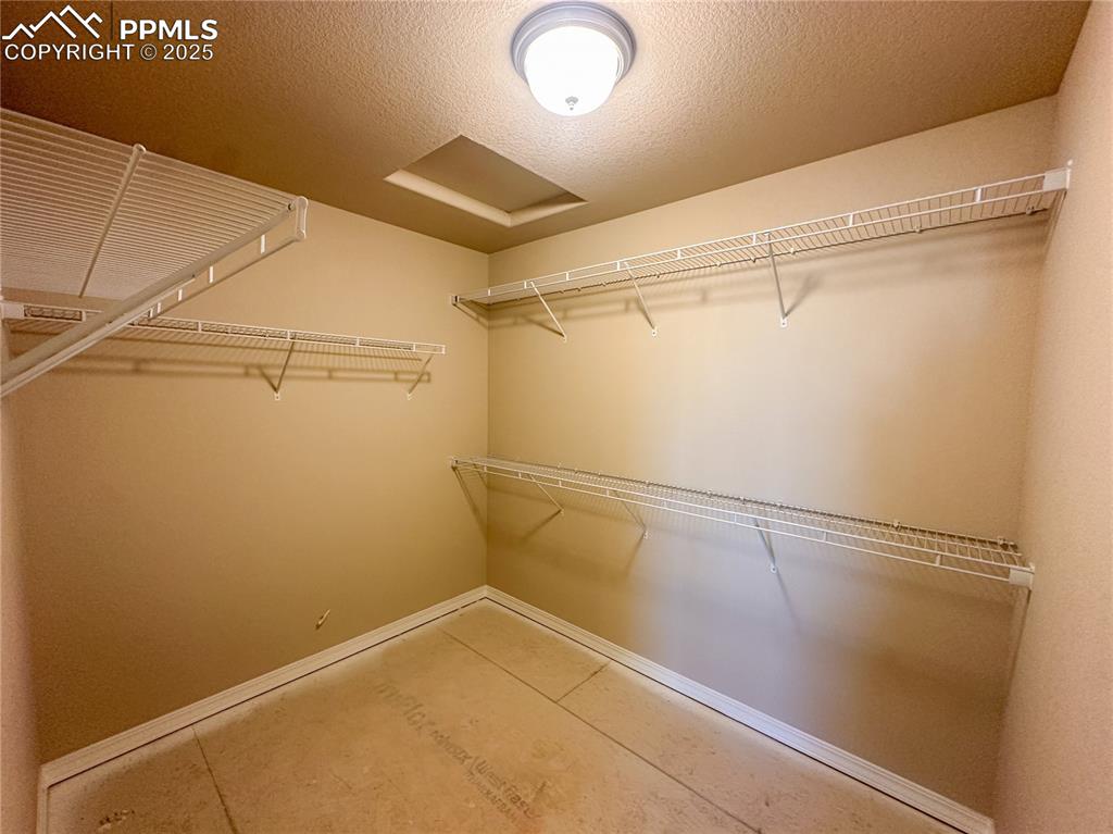 Image 18 of 19: Primary closet 